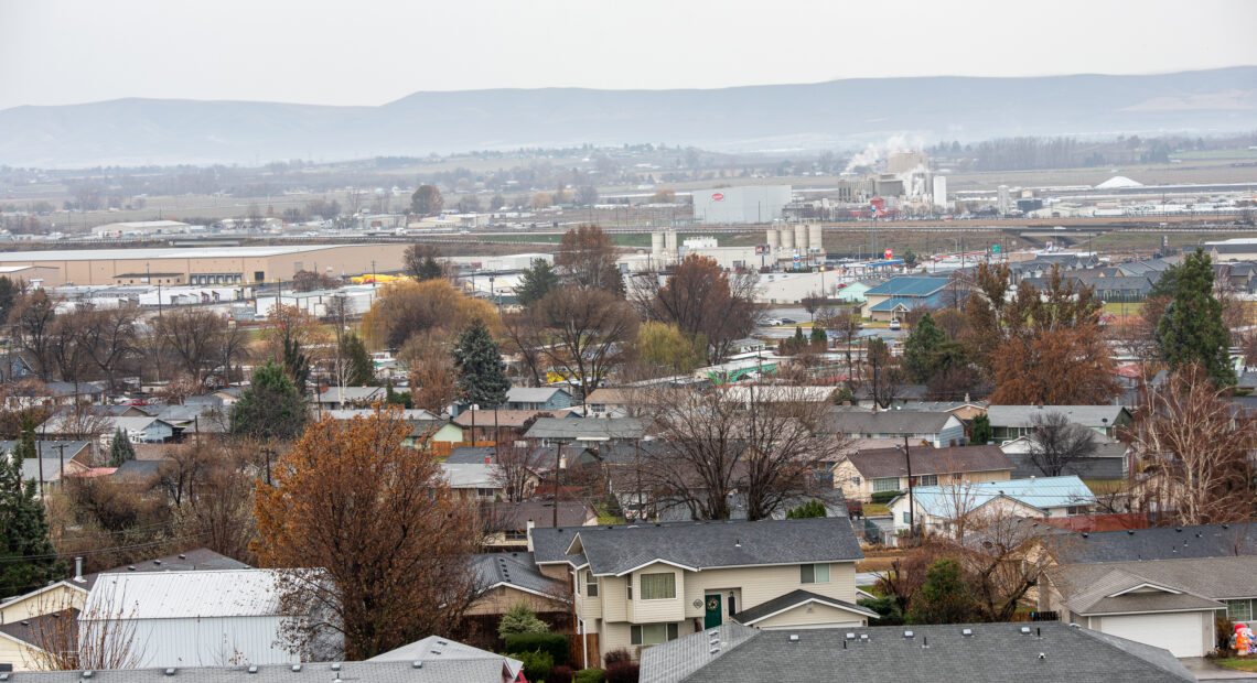 An aerial view of the city of Sunnyside, Washington. Houses and trees are in view.