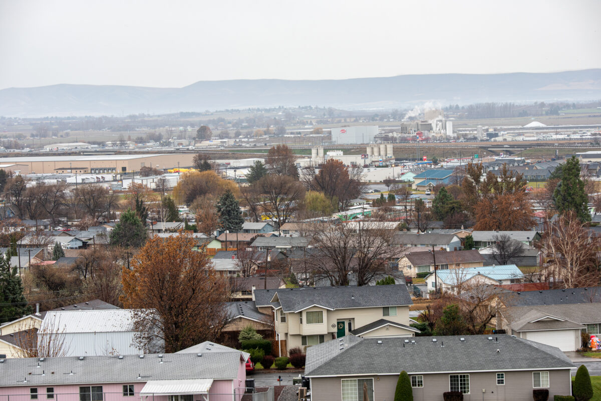 An aerial view of the city of Sunnyside, Washington. Houses and trees are in view.