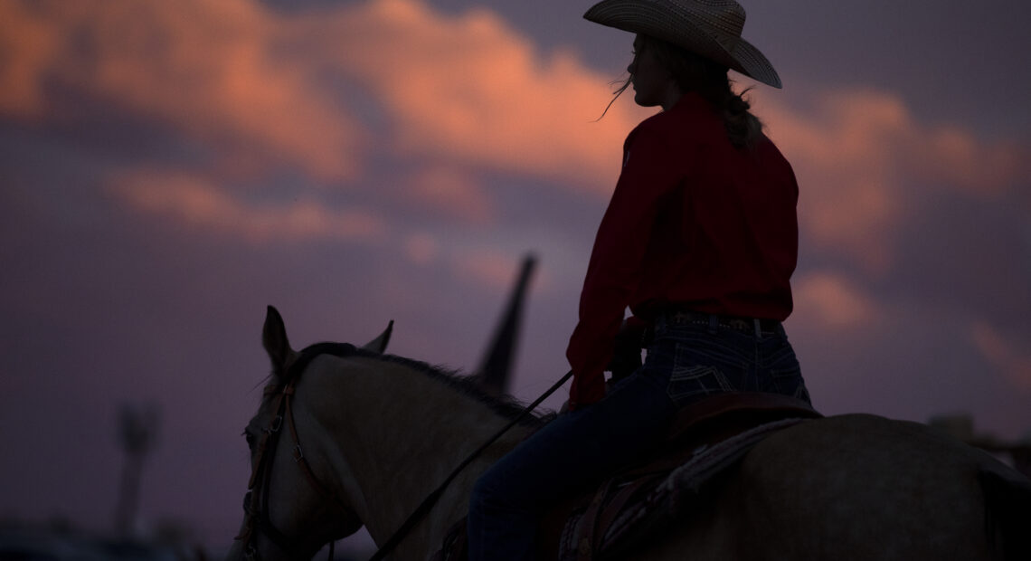 The sun sets on Friday, June 17, 2022, at the Freedom Rodeo in Basin City.