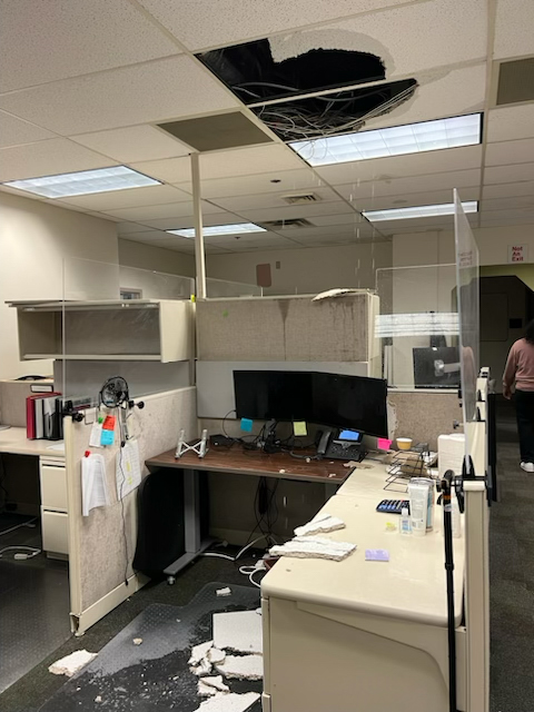 Following a November rainstorm in Seattle, leaks caused ceiling tiles to bulge and break onto a desk and the floor of the logistics office in Building 18 on the Veterans Affairs Puget Sound Health Care System campus. (Courtesy of Cortez Hopkins)