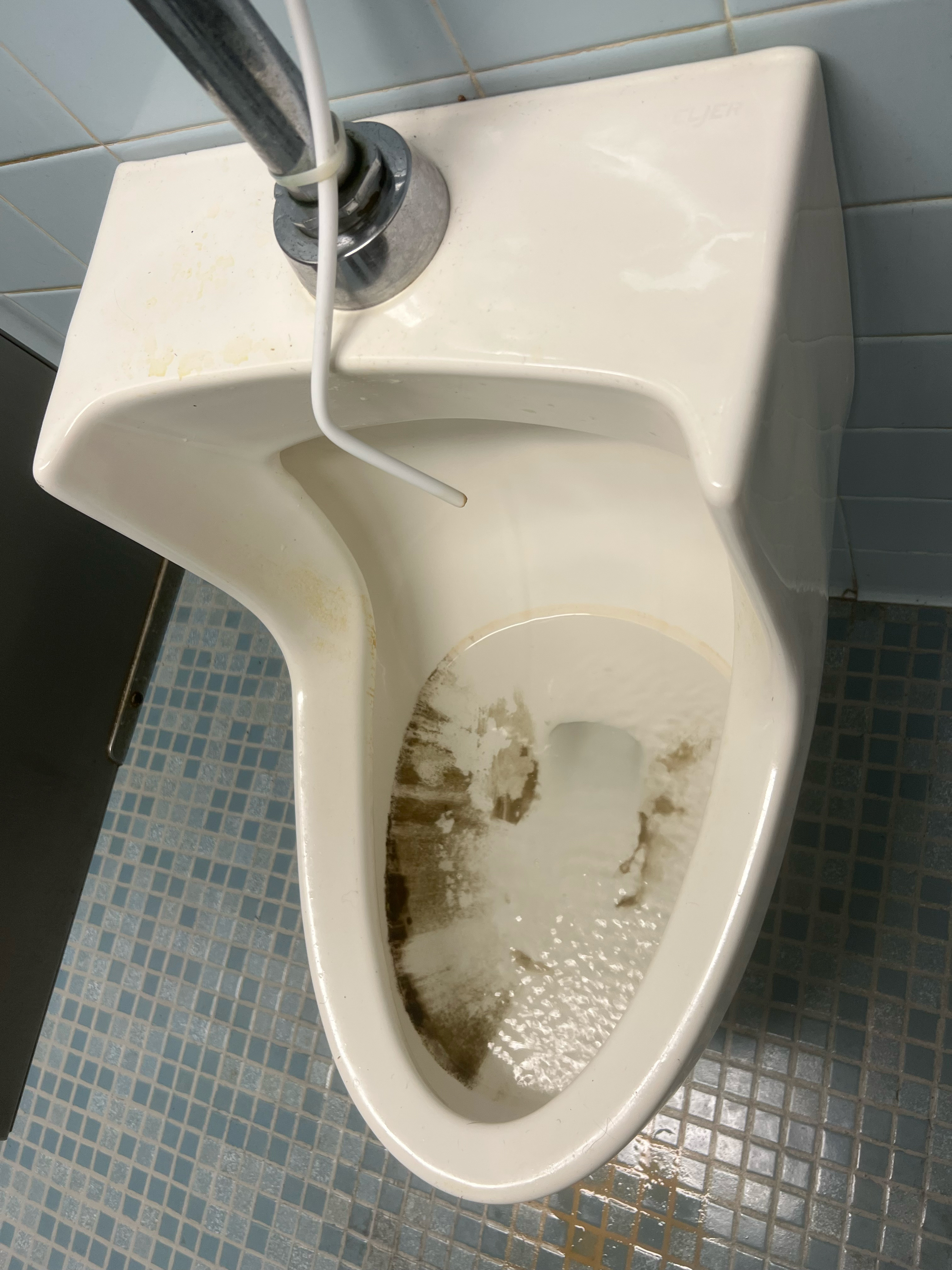Apparent mold streaks down the side of a urinal. According to Douglas Galuszka, chief of logistics who provided the photo dated June 7, 2023, it was taken in a bathroom of Building 18 on the Veterans Affairs Puget Sound Health Care System campus. (Courtesy of Douglas Galuszka)