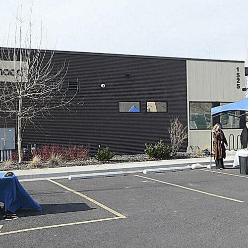 A Planned Parenthood building is pictured. A table and a blue tent is pictured in the parking lot in front of the building.