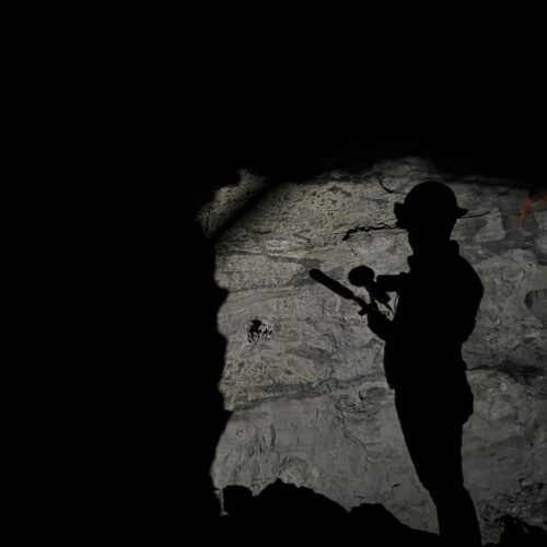 Creator and host Alec Cowan’s shadow during a tour of the Sunday Mine Complex, a complex of five uranium mines in the Big Gypsum Valley near Paradox, Colorado, on Feb. 19, 2024.