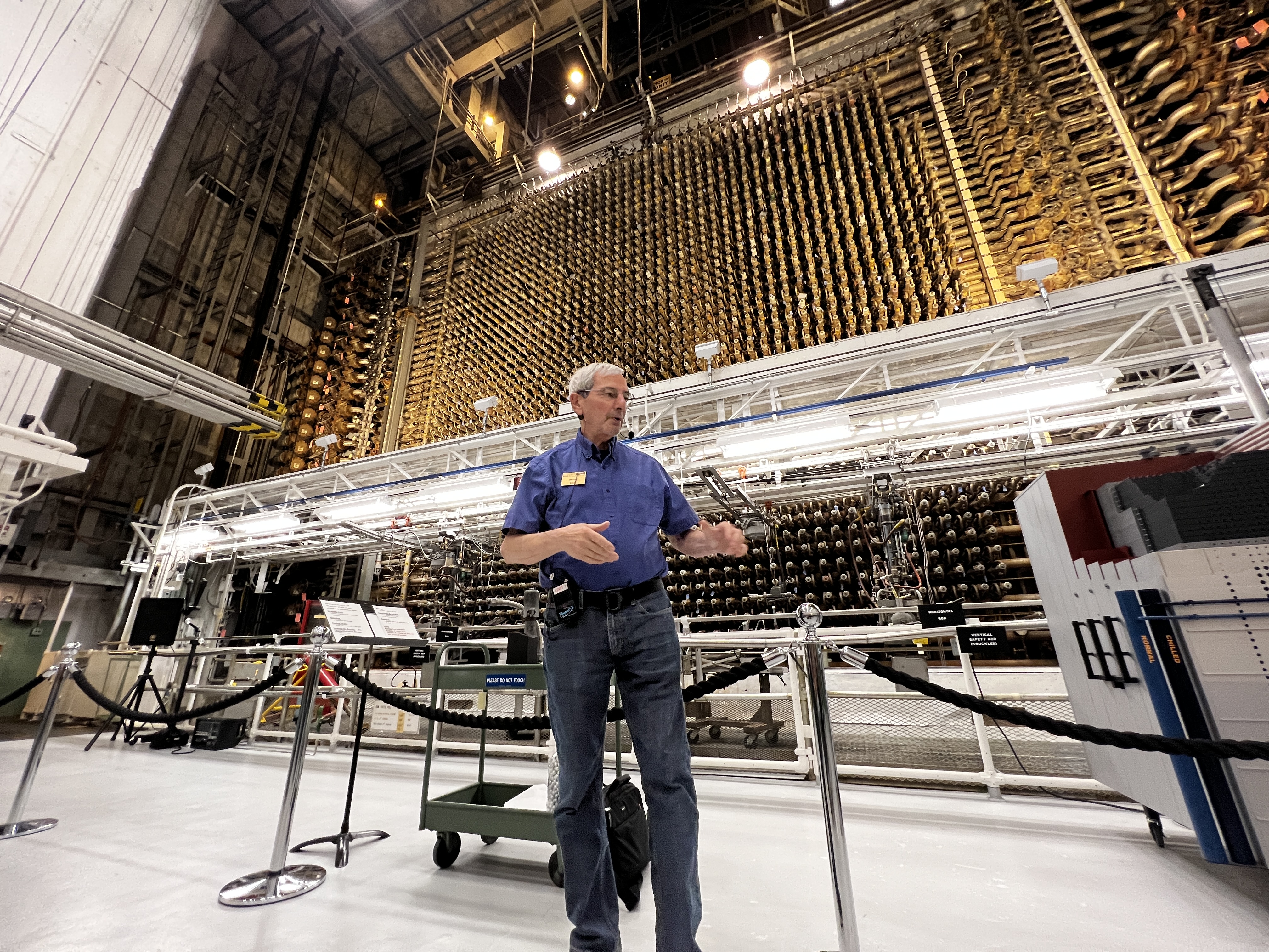 A Department of Energy docent gives a presentation in front of the reactor core at Hanford’s B Reactor on Sept. 8, 2023.