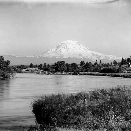 View of Mount Rainier looking southeast up Puyallup River, Tacoma, July 10, 1899. The dam was built on the river in 1904. (Courtesy: Wikimedia Commons)