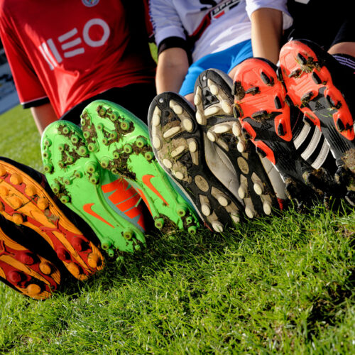 Closed-up-with-children-wearing-Football-or-Soccer-boots_Credit_Adfoto_stock.adobe