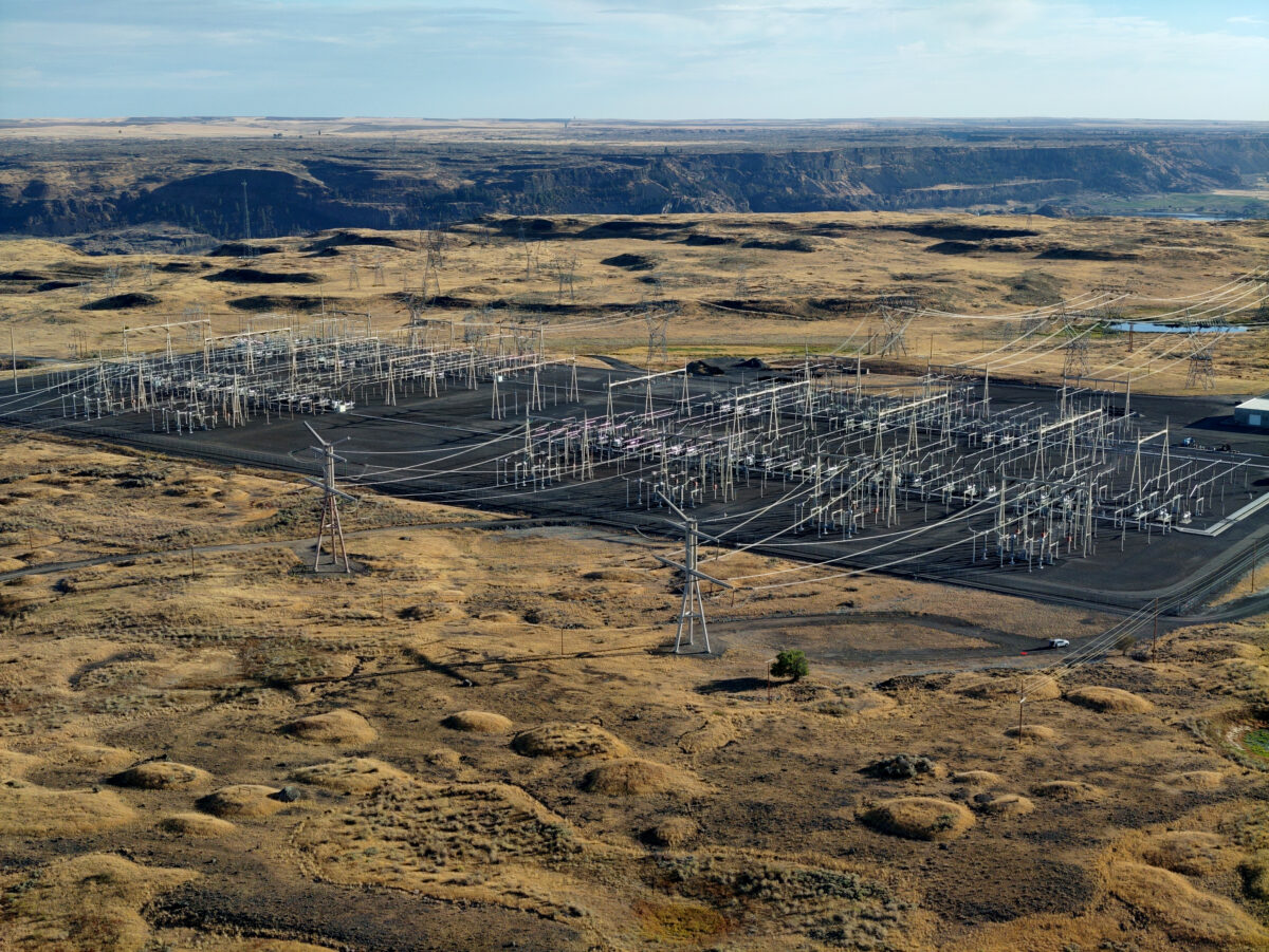 Large electrical transmission equipment is in a brown square. Shrub-steppe habitat surrounds the equipment.