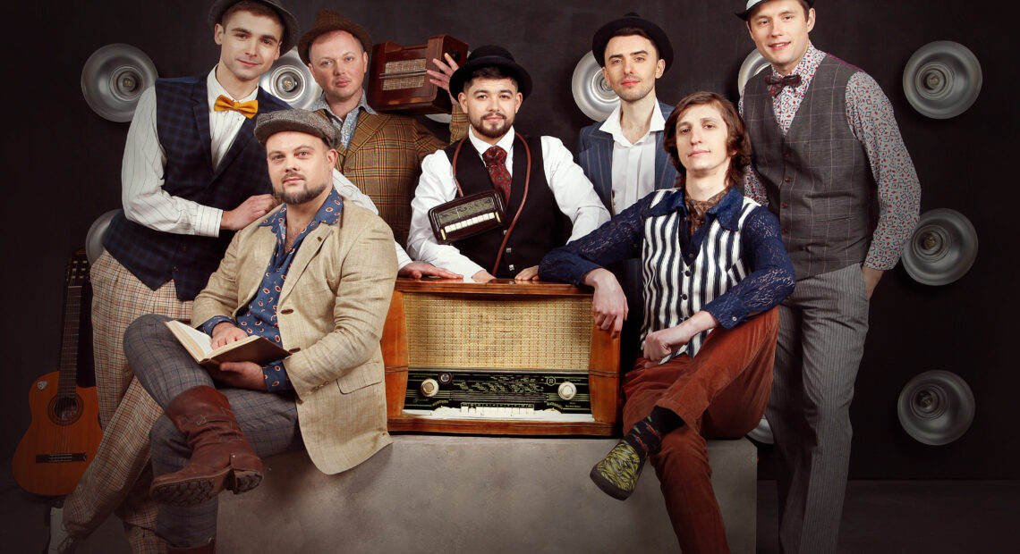 Seven members of a Ukrainian band look at the camera.