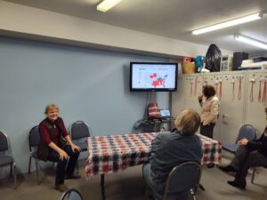 Clallam County Republican Party Chair Pam Blakeman, sits next to a screen showing early results in the 2024 presidential race.(Courtesy of Pam Blakeman)