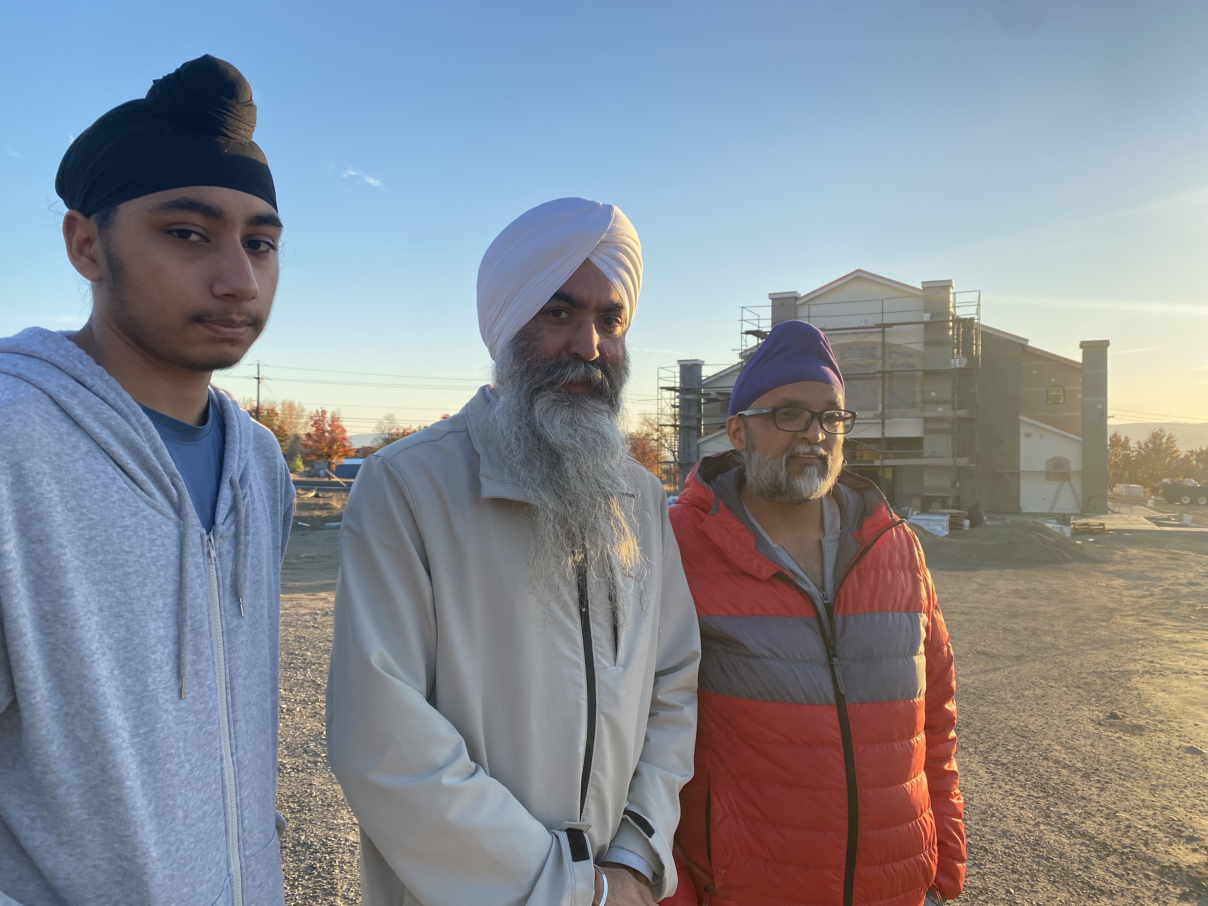 From left, Jodhpal Singh, 16, head priest Jaspal Singh, and Kamaljit Singh Chauhan, 43, stand in front of the under-construction Gurudwara Singh Sabha of Yakima, Wash. The Sikh temple is slated to open in the Spring of 2025. 