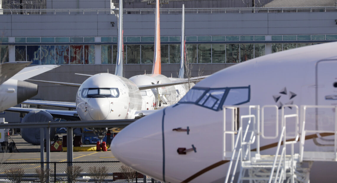 Grounded Boeing 737 MAX airplanes fill a parking area adjacent to Boeing Field Wednesday, Feb. 19, 2020, in Seattle. (AP Photo/Elaine Thompson)