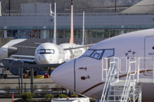 Grounded Boeing 737 MAX airplanes fill a parking area adjacent to Boeing Field Wednesday, Feb. 19, 2020, in Seattle. (AP Photo/Elaine Thompson)