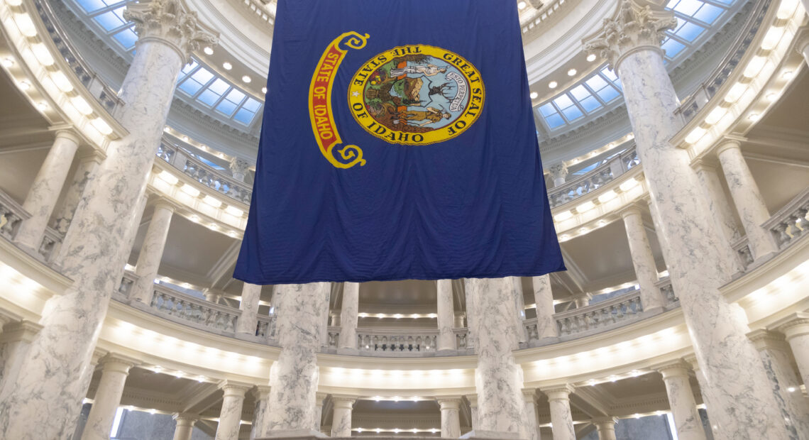 Idaho's blue state flag hangs from the ceiling in the state capital building.