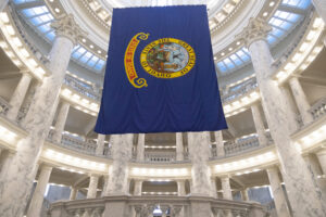 Idaho's blue state flag hangs from the ceiling in the state capital building.